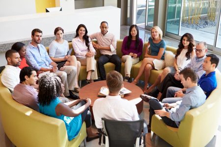 A Round table meeting with 15 individuals.